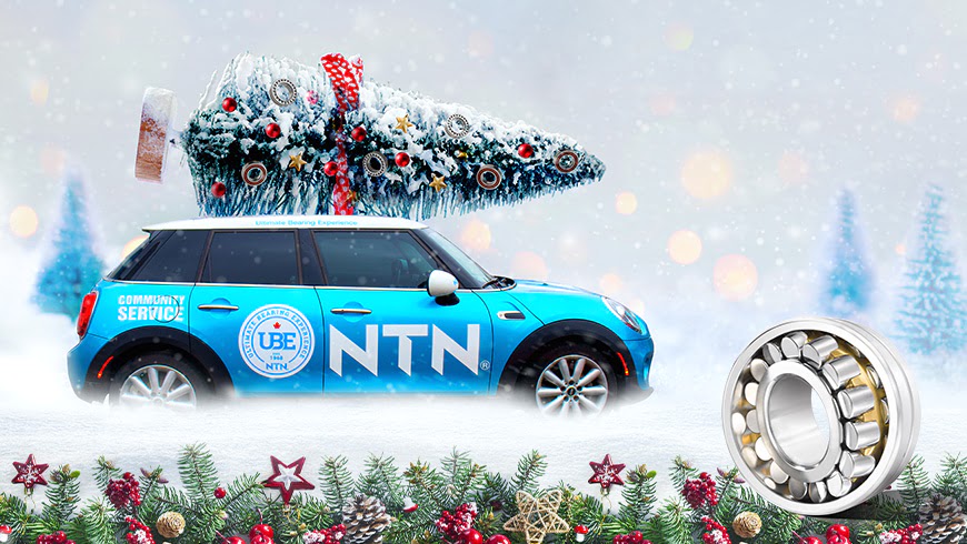 blue car with NTN logo on the side and a Christmas tree on top